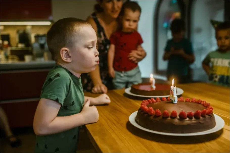 Family Blowing Candles Birthday Cake Close Up 3ab0