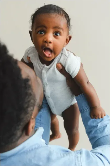 Detail Father Burping Baby Over Shoulder Number 10
