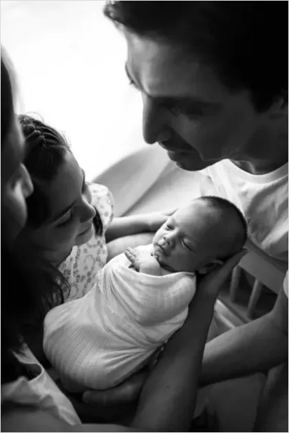 Detail New Big Sibling Holding Newborn Gently Number 13