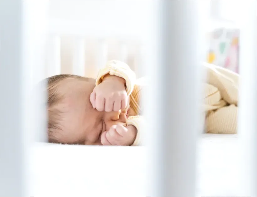 Newborn Baby Sleeping In Crib E142