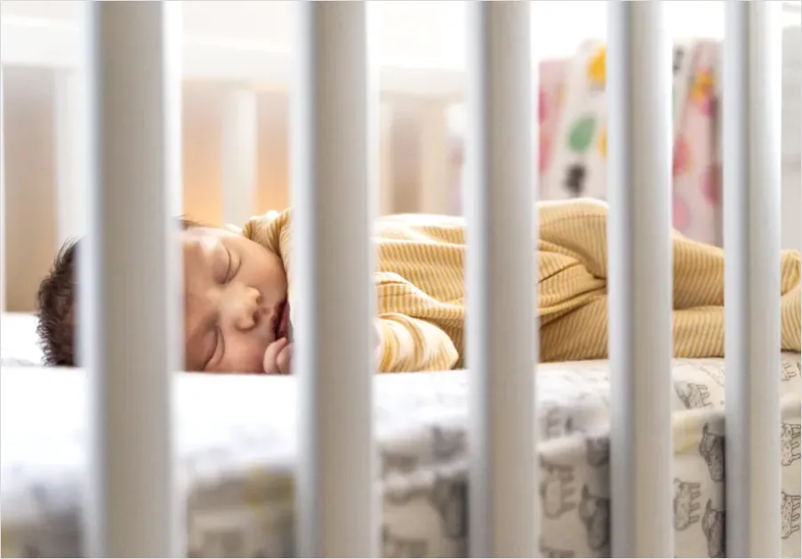 Detail Newborn Baby Sleeping In Crib Number 2