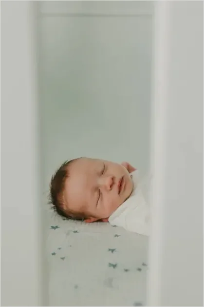 Detail Newborn Baby Sleeping In Crib Number 3