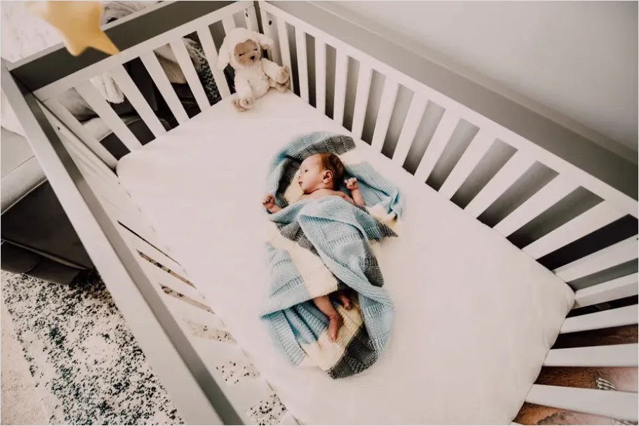 Detail Newborn Baby Sleeping In Crib Number 4