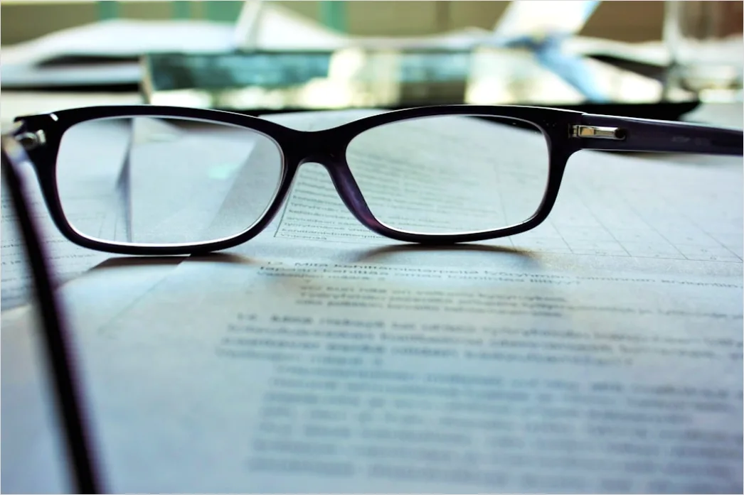 Detail Reading Glasses On Book Number 12