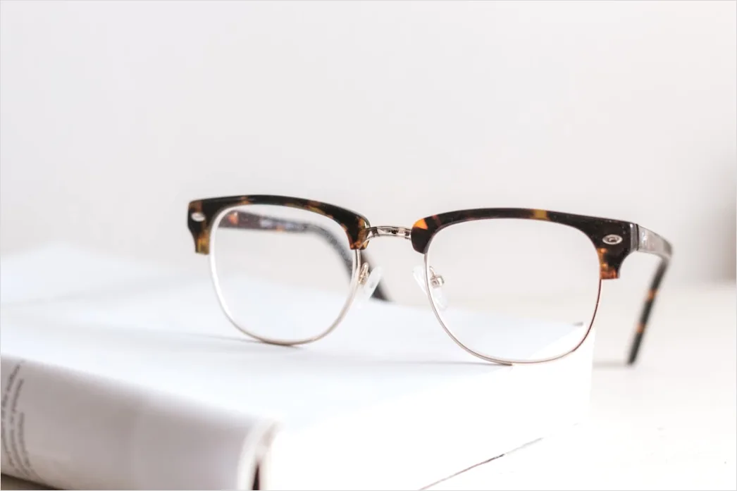 Detail Reading Glasses On Book Number 3