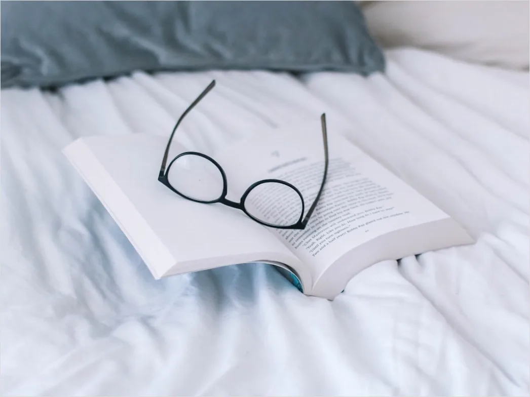 Detail Reading Glasses On Book Number 5