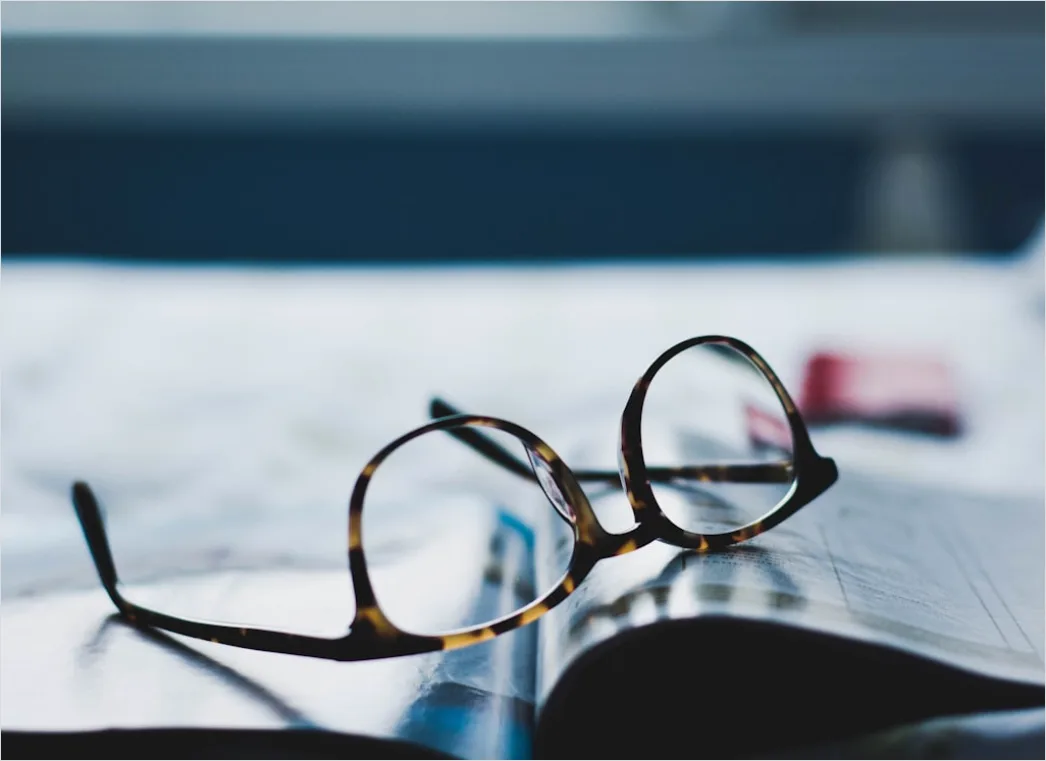 Detail Reading Glasses On Book Number 7