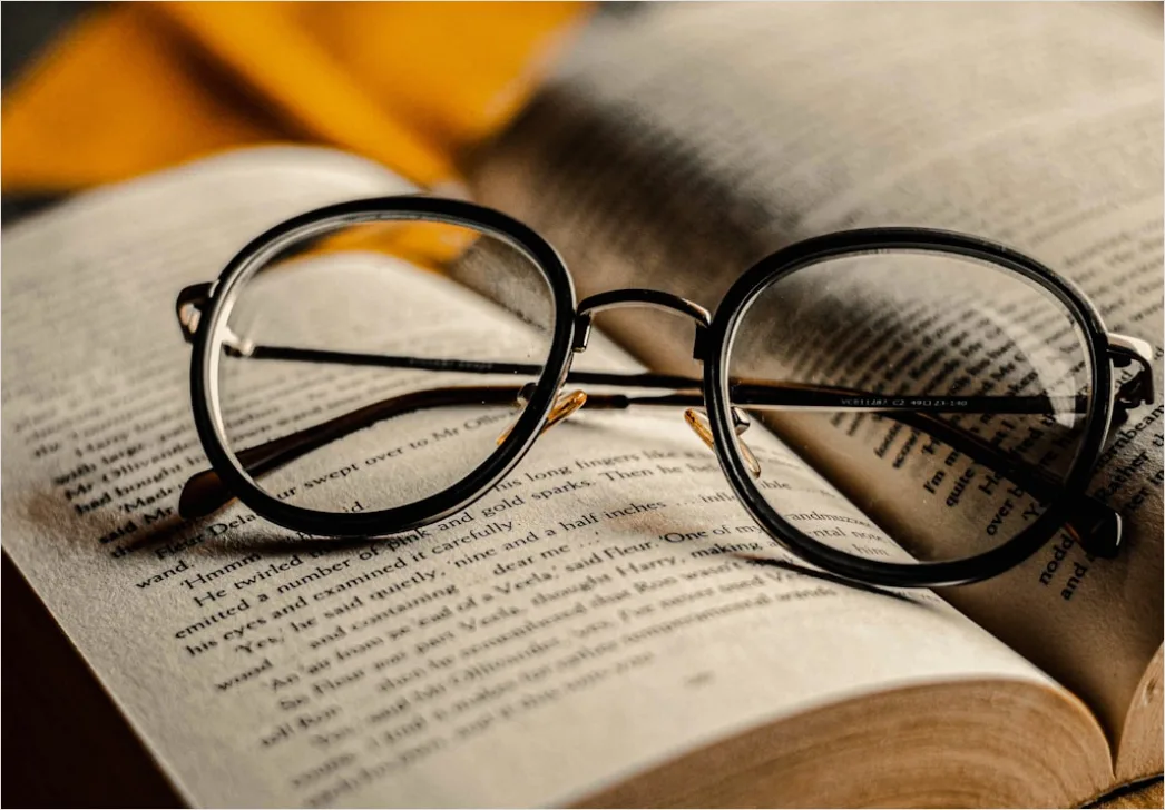Detail Reading Glasses On Book Number 9