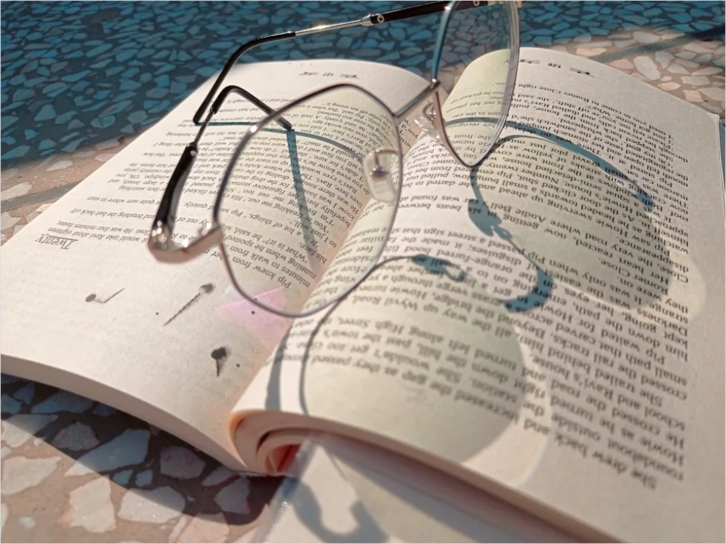 Detail Reading Glasses On Book Number 10