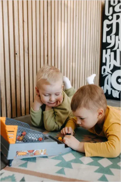 Detail Siblings Playing Together Floor Toys Number 3