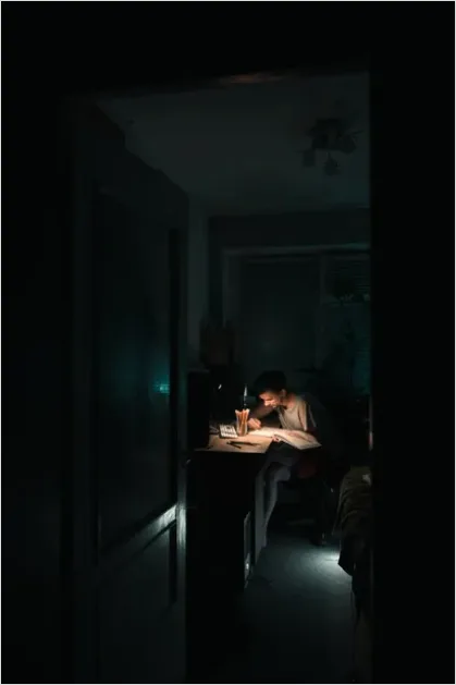 Teen Doing Homework Late Night Desk C554