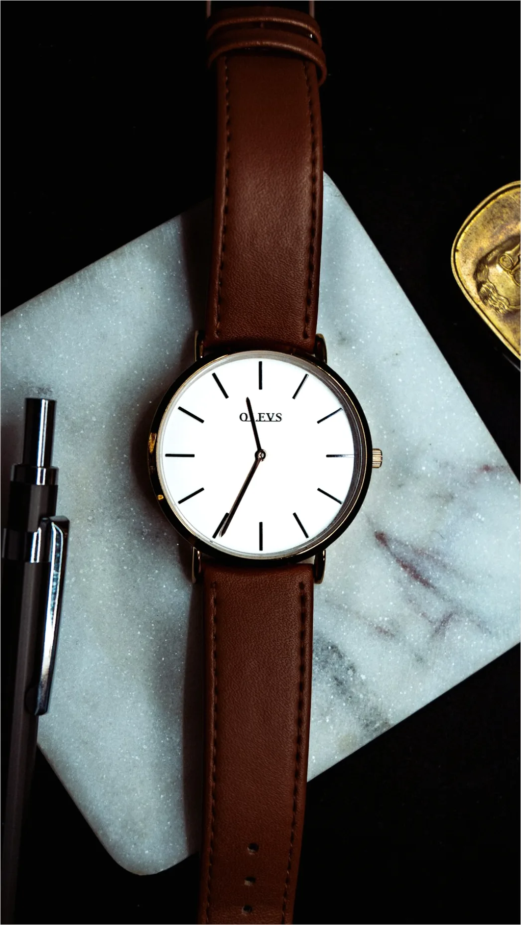 Detail Wristwatch On Marble Flat Lay Number 9