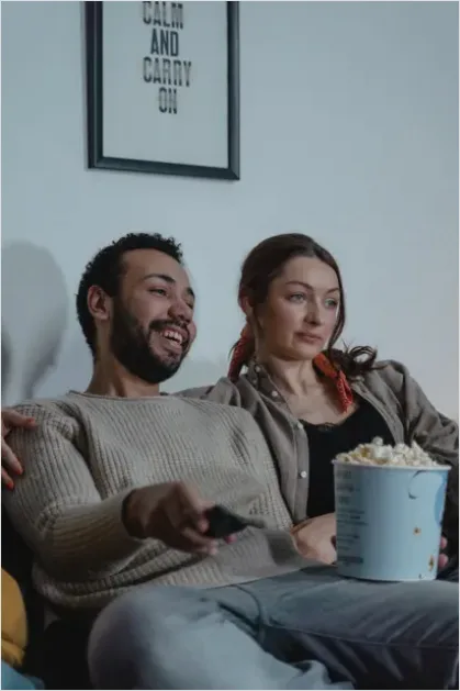 Detail Couple Watching Movie On Couch Number 2