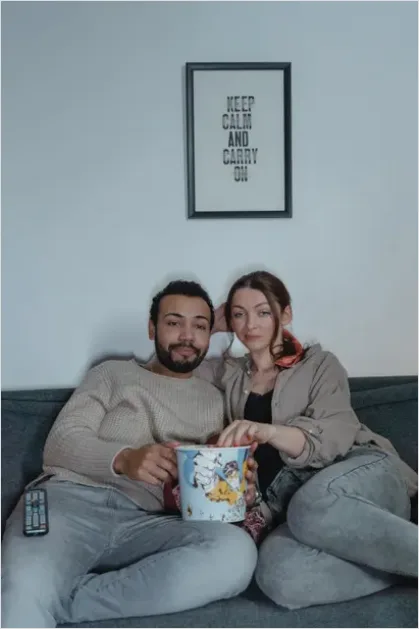 Detail Couple Watching Movie On Couch Number 6