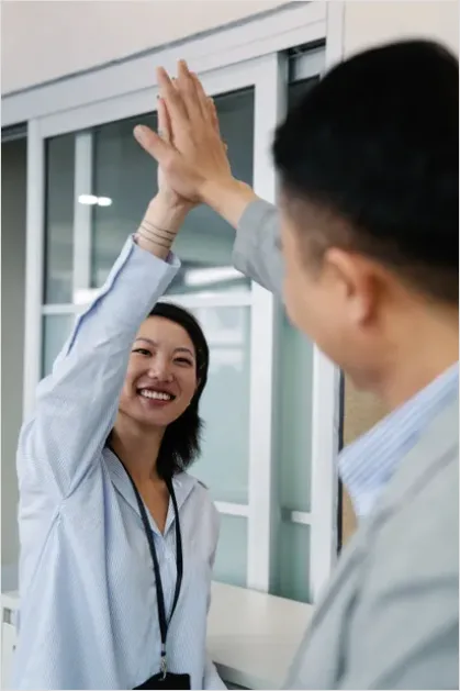 Detail Coworkers High Five Success Moment Number 16