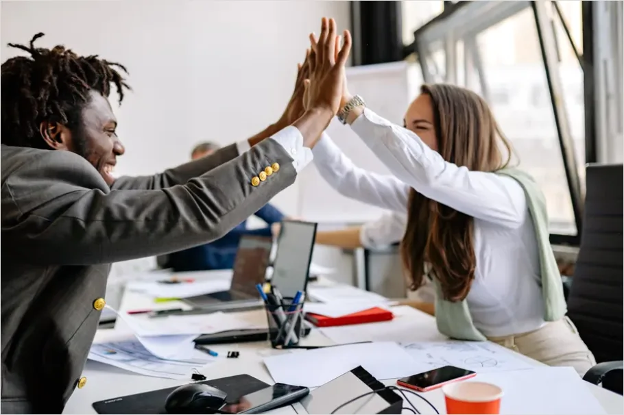 Detail Coworkers High Five Success Moment Number 3