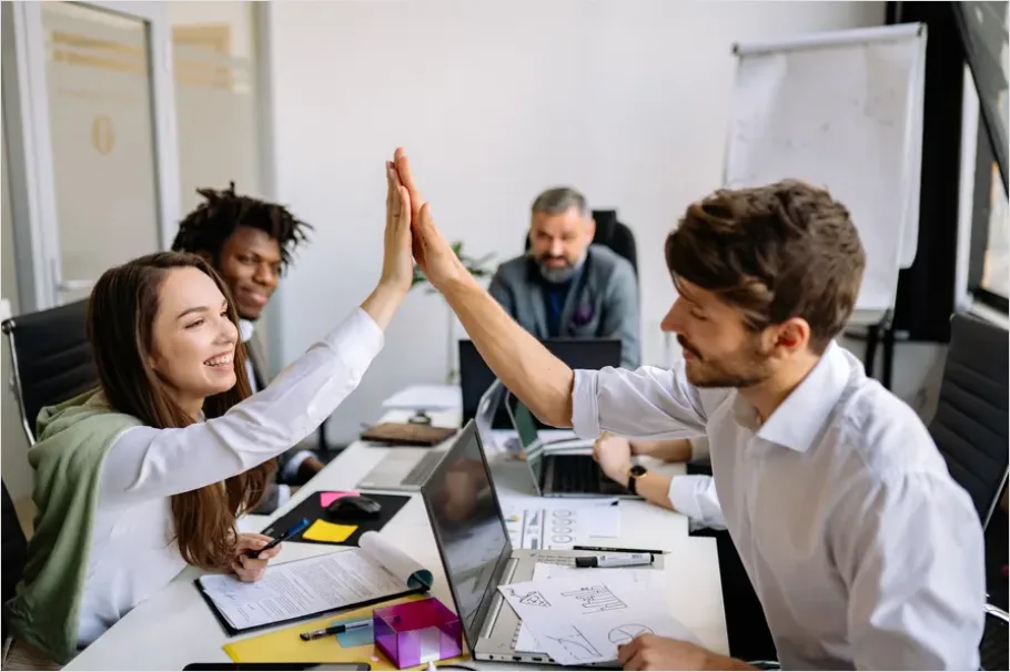 Detail Coworkers High Five Success Moment Number 6