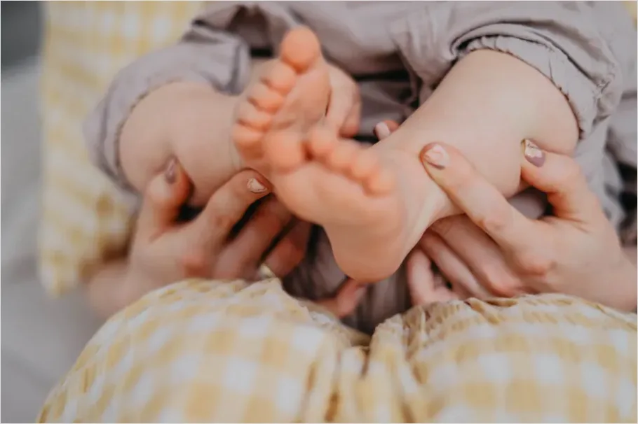 Detail Mother Hands Holding Baby Feet Number 11