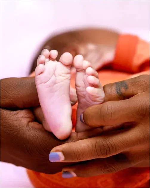 Detail Mother Hands Holding Baby Feet Number 13