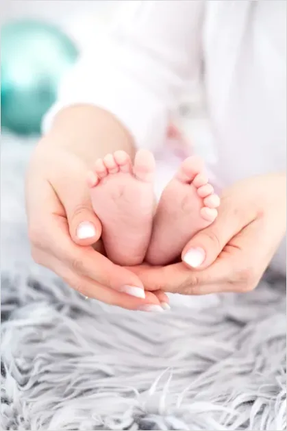 Detail Mother Hands Holding Baby Feet Number 4