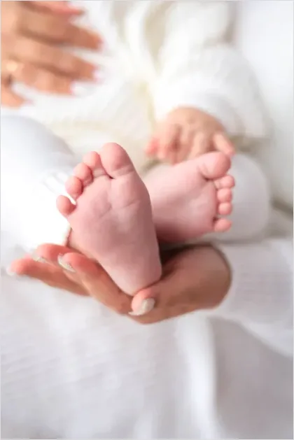 Detail Mother Hands Holding Baby Feet Number 5