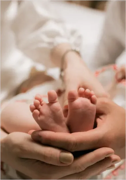 Detail Mother Hands Holding Baby Feet Number 6