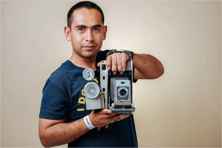 Detail Photographer Holding Camera Portrait Number 2