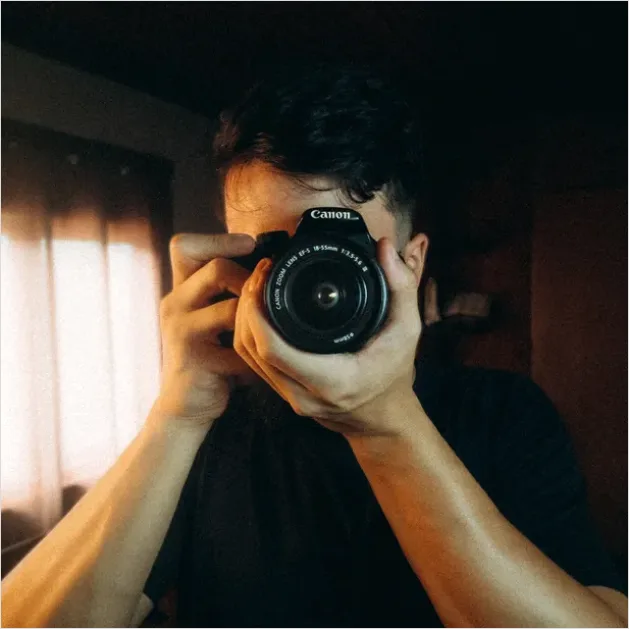 Detail Photographer Holding Camera Portrait Number 5