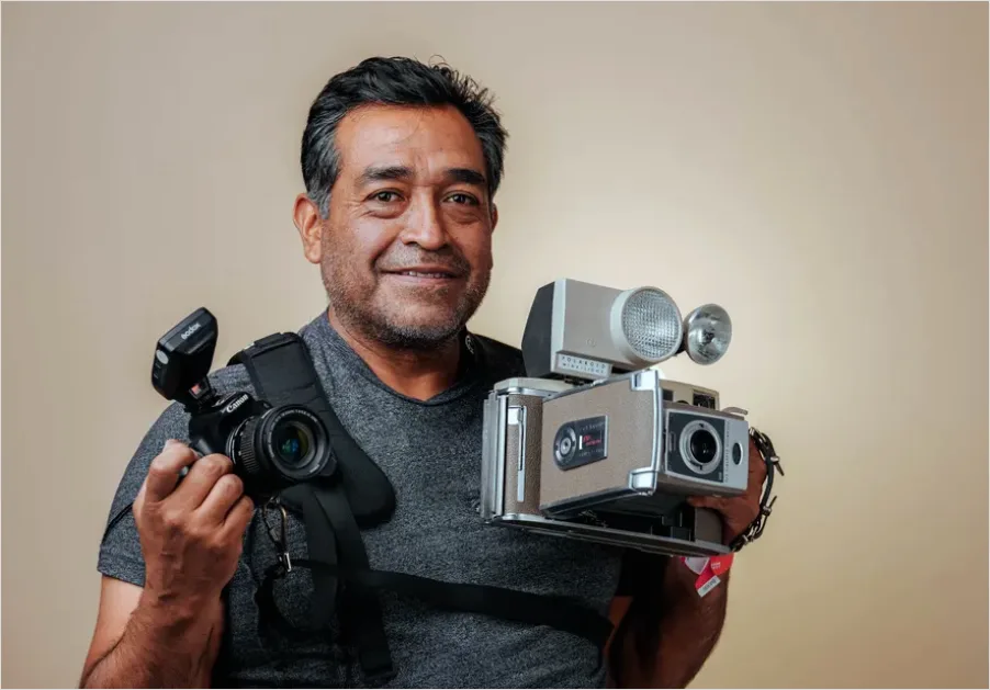 Detail Photographer Holding Camera Portrait Number 7