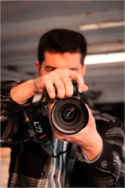 Detail Photographer Holding Camera Portrait Number 9
