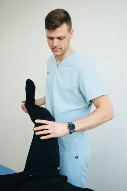 Detail Physical Therapist Helping Patient Stretch Number 11