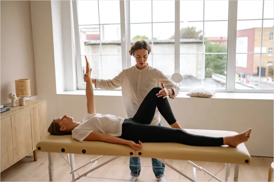 Detail Physical Therapist Helping Patient Stretch Number 12