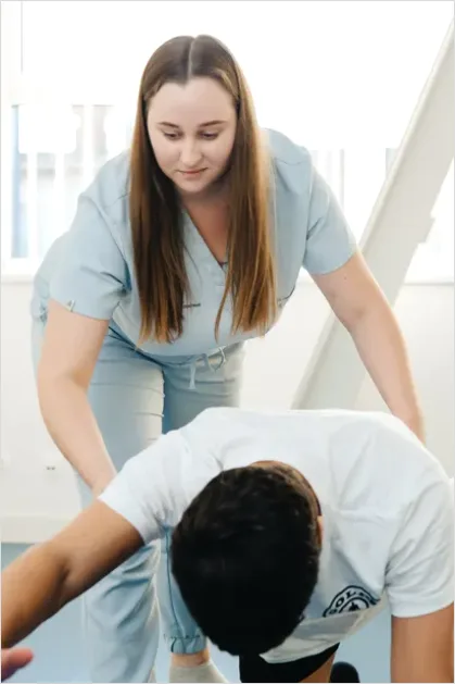 Detail Physical Therapist Helping Patient Stretch Number 13