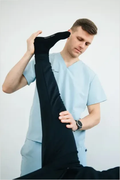Detail Physical Therapist Helping Patient Stretch Number 16