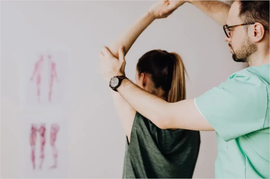 Detail Physical Therapist Helping Patient Stretch Number 4