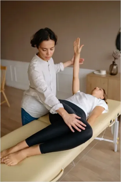 Detail Physical Therapist Helping Patient Stretch Number 6