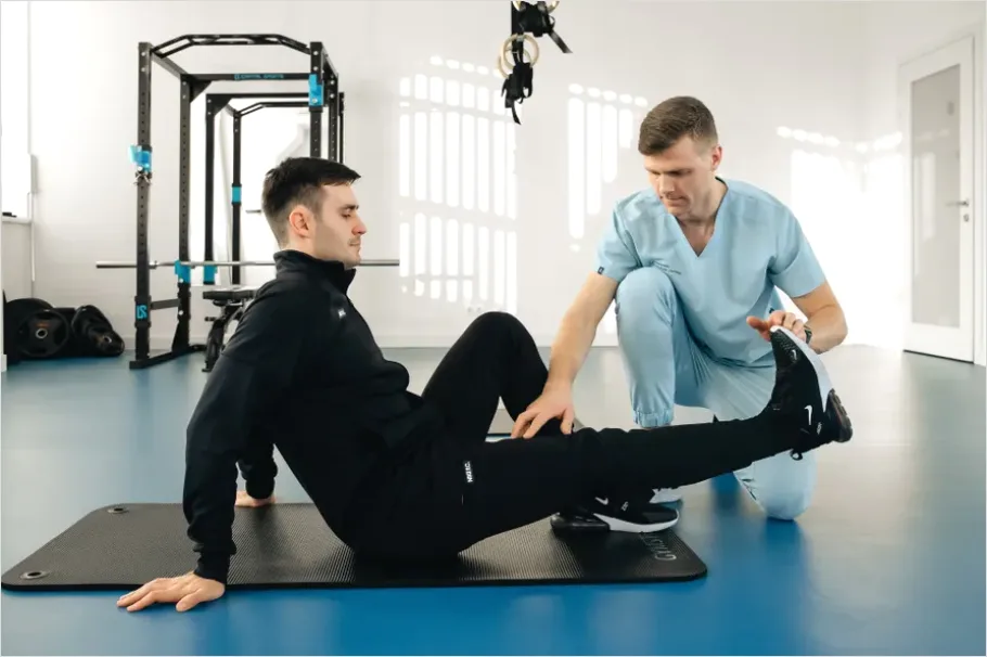 Detail Physical Therapist Helping Patient Stretch Number 7