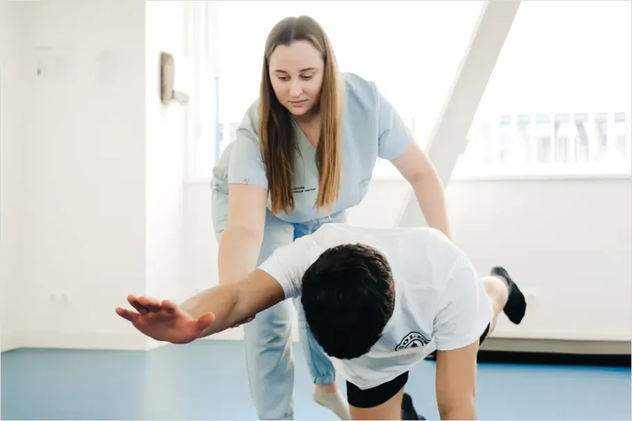 Detail Physical Therapist Helping Patient Stretch Number 9