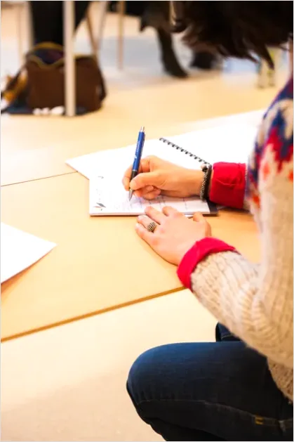 Detail Student Writing Notes In Notebook Number 5