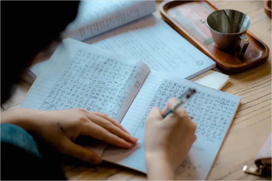 Detail Student Writing Notes In Notebook Number 9