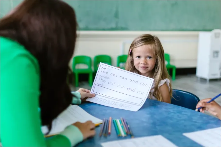 Detail Teacher Helping Student In Classroom Number 11