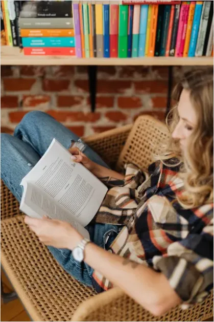 Detail Woman Reading Book Cozy Chair Number 7