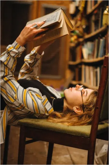 Detail Woman Reading Book Cozy Chair Number 8