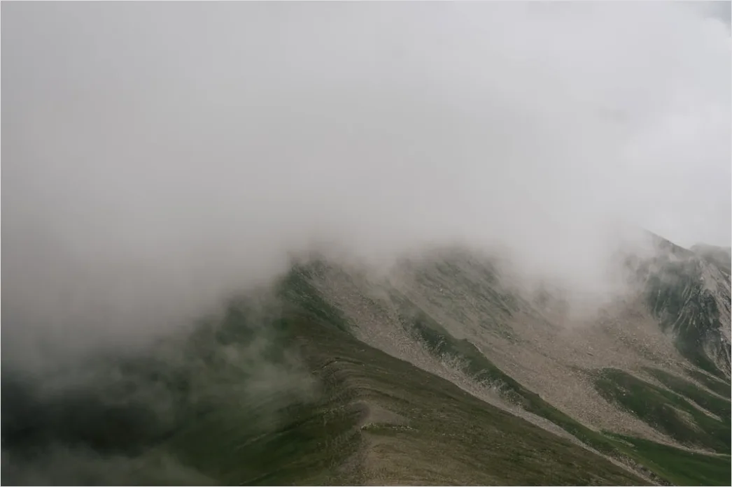 Detail Low Clouds Hugging Mountain Slopes Number 13